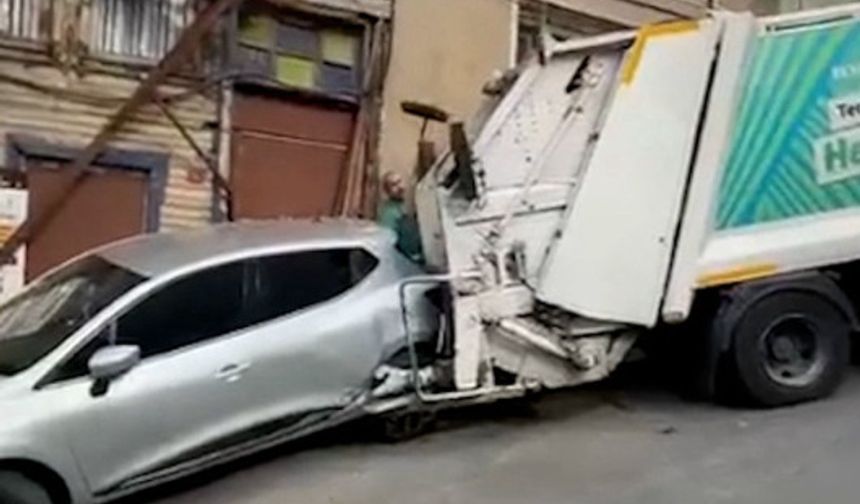 Yokuşta kayan çöp kamyonu bina ve otomobile hasar verdi